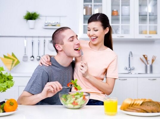 the woman feeds the man with products to naturally increase potency